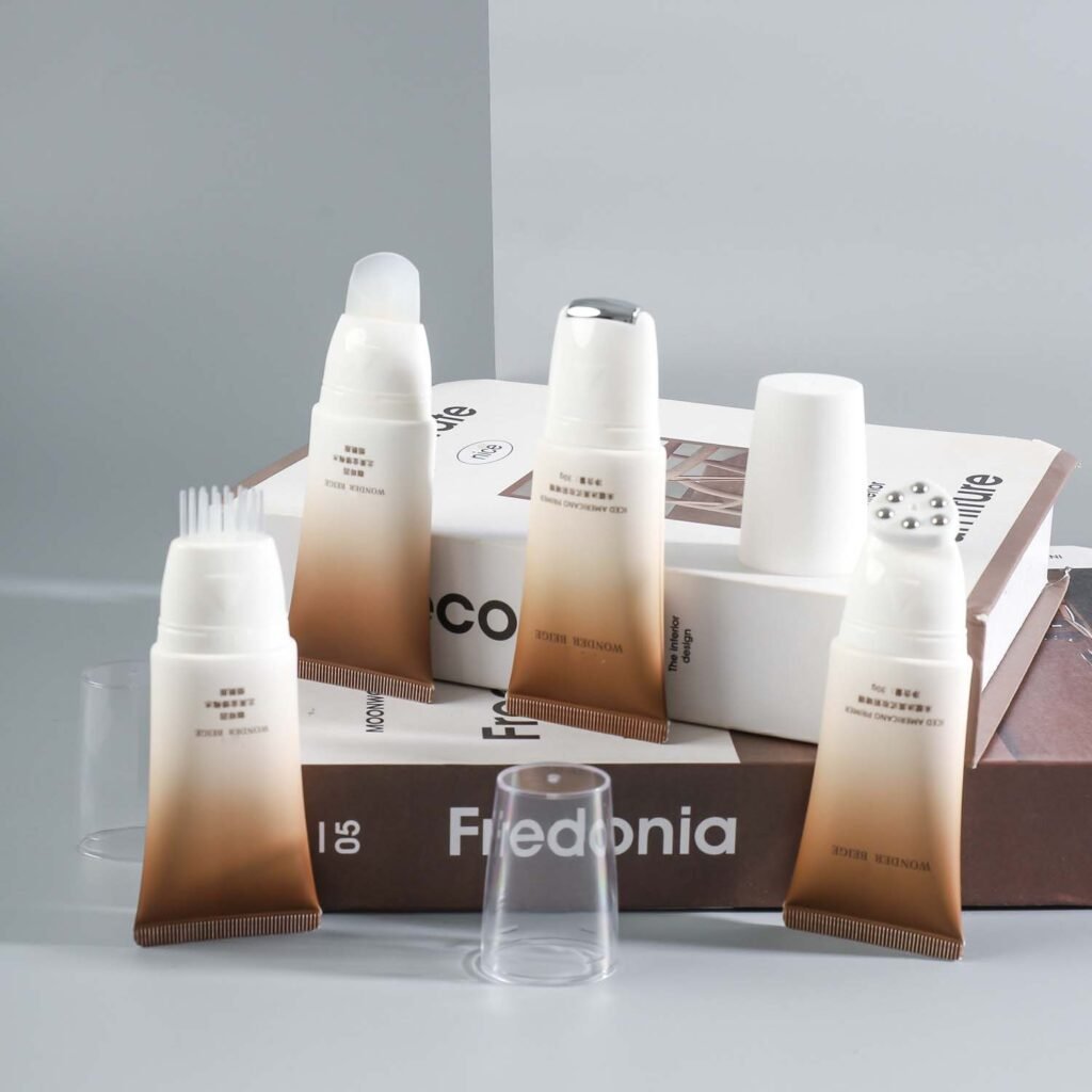 Applicator cosmetic tube packaging with massage applicator head for skincare products