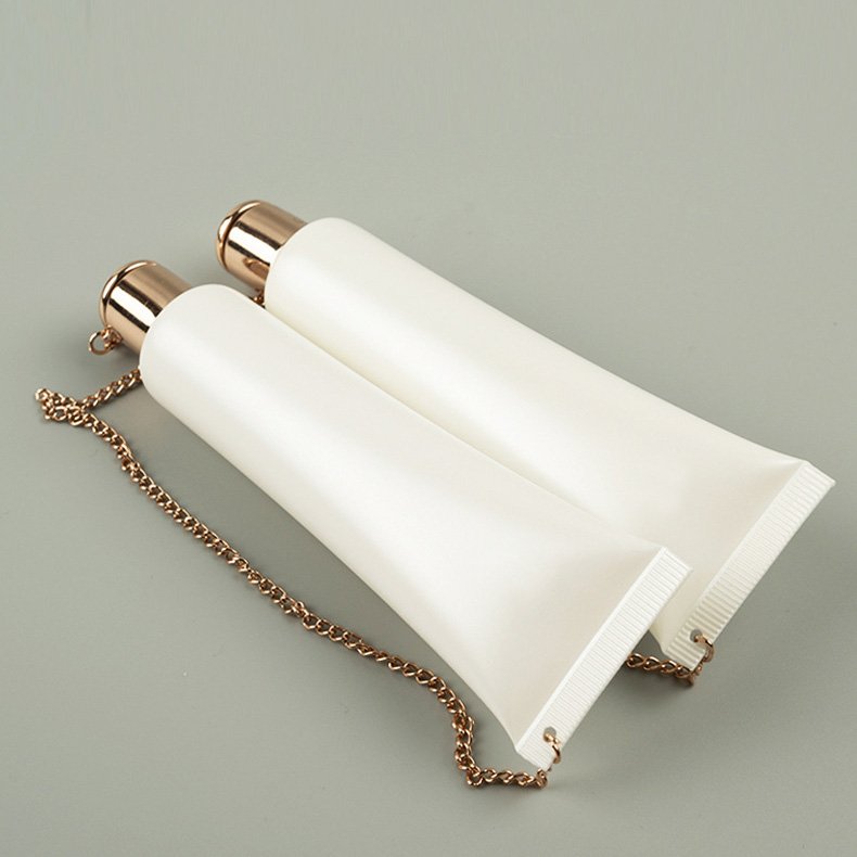 Plastic cosmetic tube with chain hole for portable beauty products